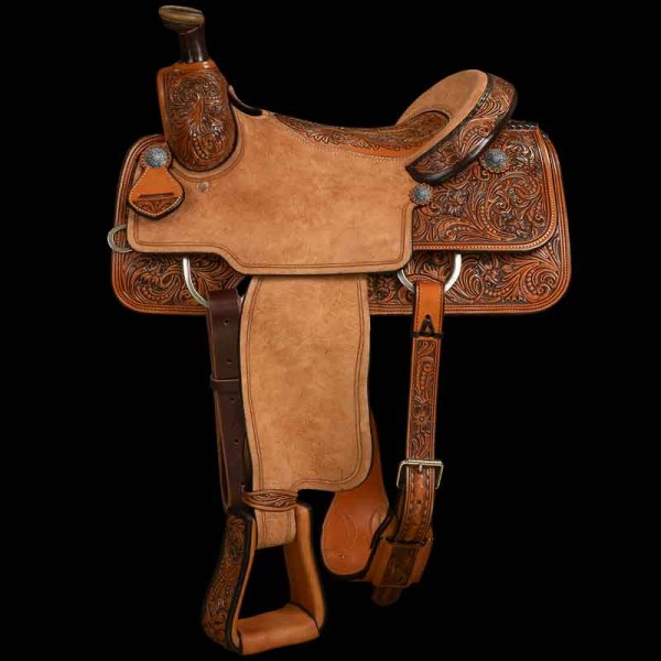 Our beautiful Half Carved Roper Saddle has beautiful leather tooling on the Skirts, Pommel and Stirrups.  Ready to rumble with a suede and roughout seat with plenty of traction. Customize this saddle today!
